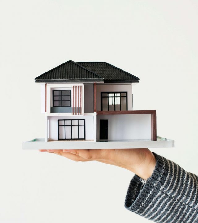 hand-presenting-model-house-home-loan-campaign (1)